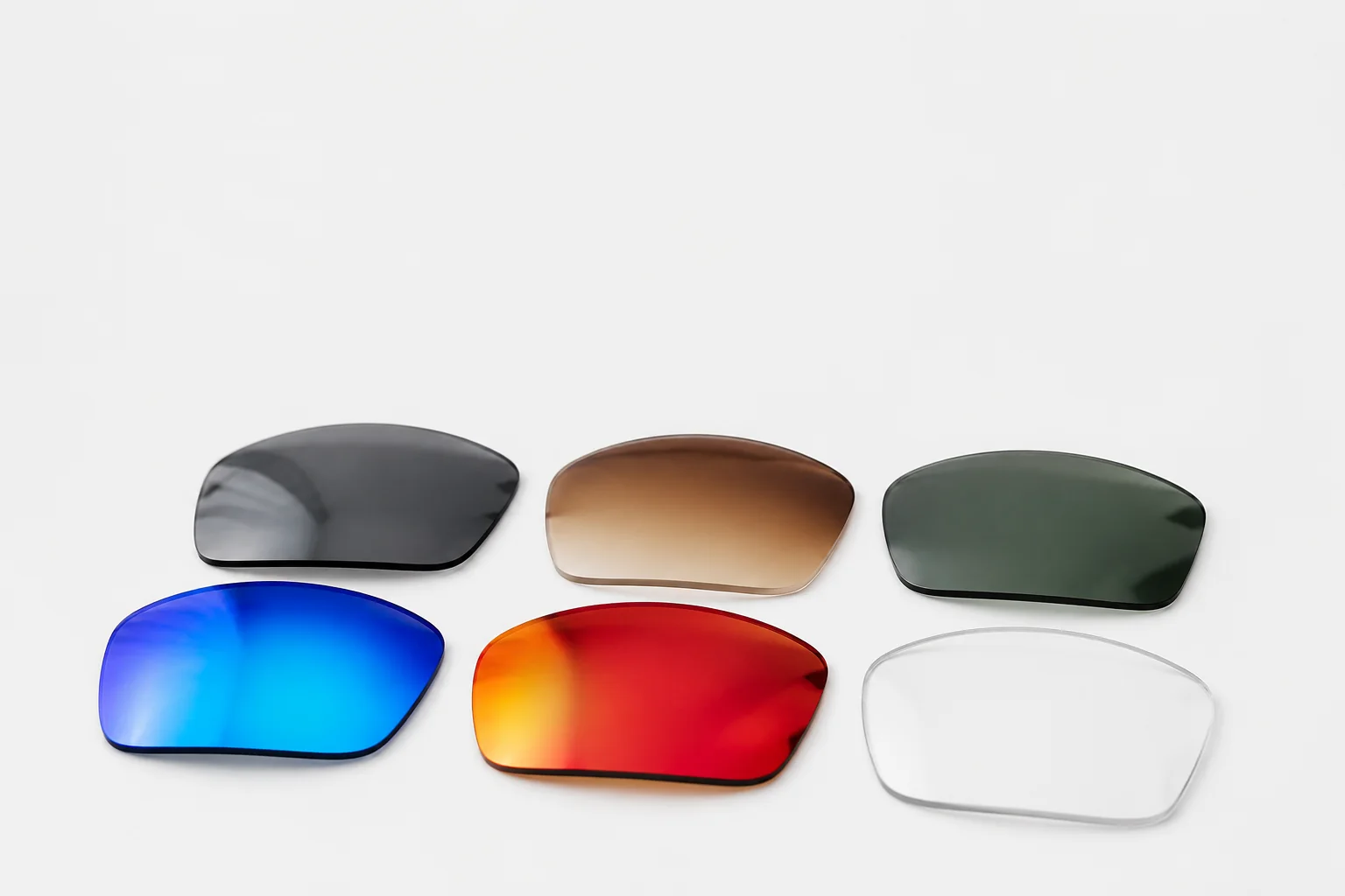 Mirror and gradient sunglasses lens options on a white product surface