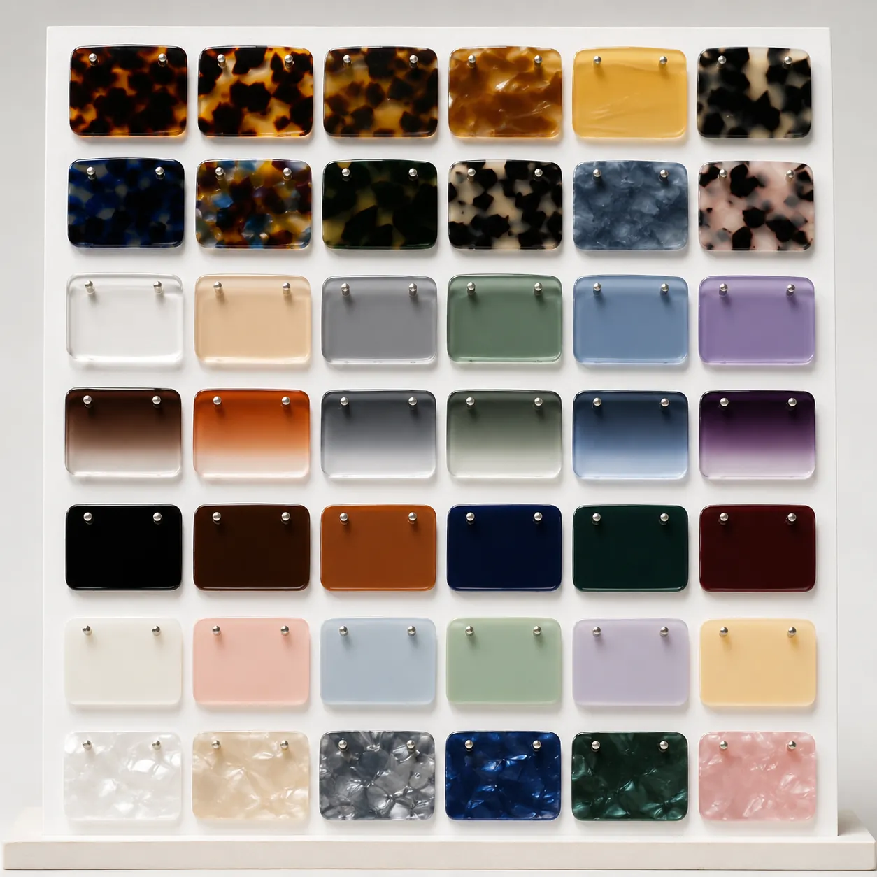 Sunglasses frame material swatches — acetate, TR90 nylon, metal alloy, bio-acetate and wood for custom eyewear