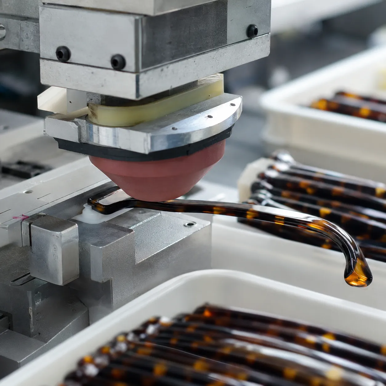 Pad printing a logo onto an acetate sunglasses temple